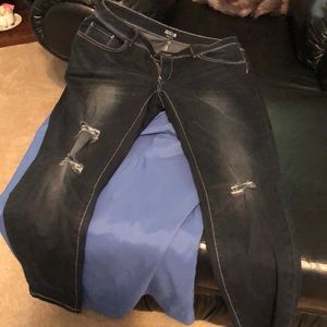 A pair of distressed jeans